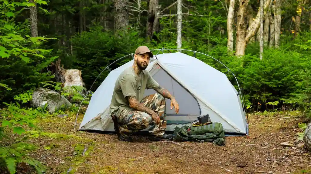 Close up on a plate of mashed potatoes, topped with baked pork chops with cream of mushroom soup, and a side of green beans.