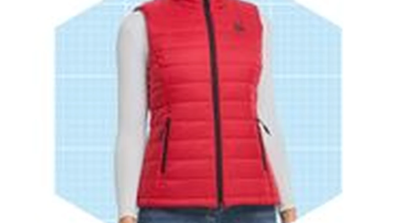 Close up on a plate of mashed potatoes, topped with baked pork chops with cream of mushroom soup, and a side of green beans.