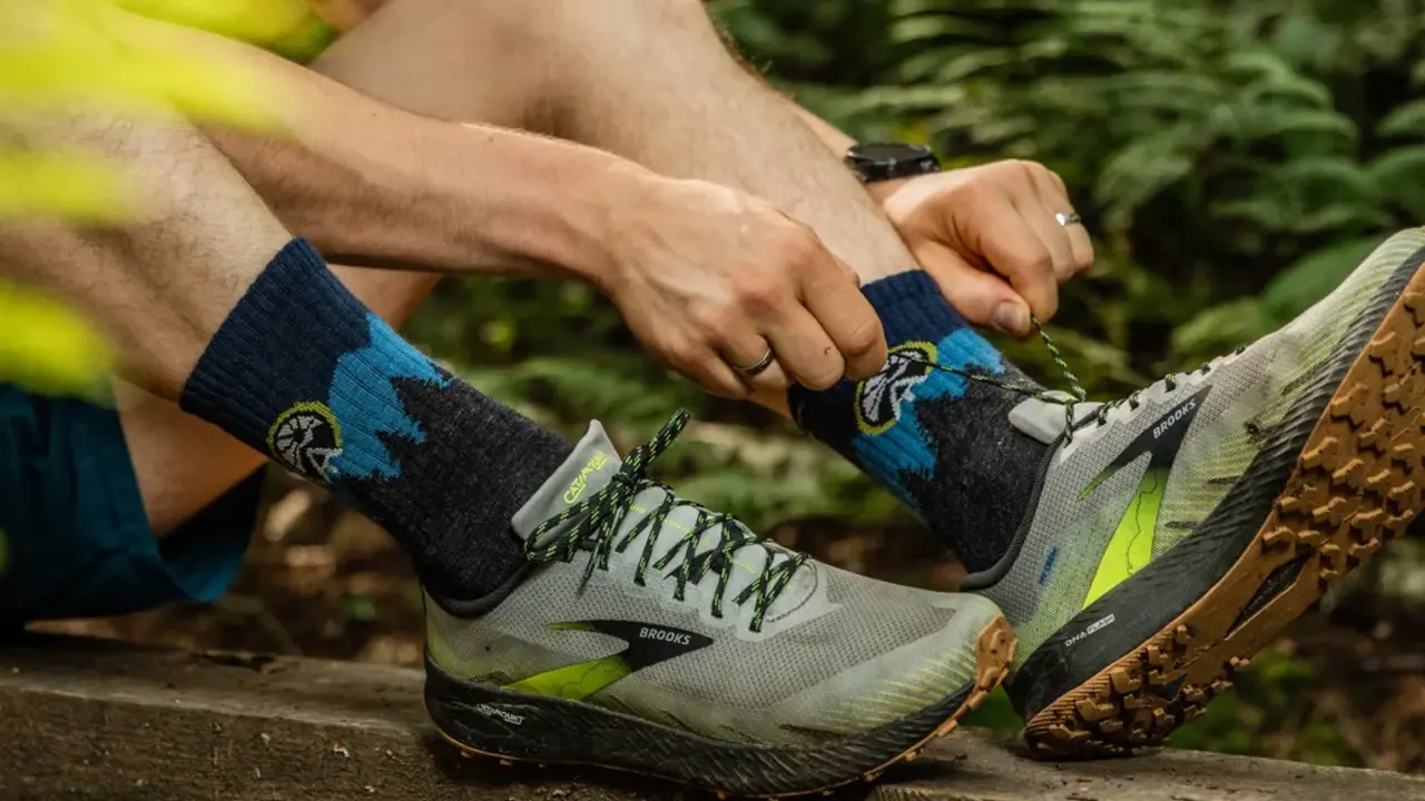 Close up on a plate of mashed potatoes, topped with baked pork chops with cream of mushroom soup, and a side of green beans.