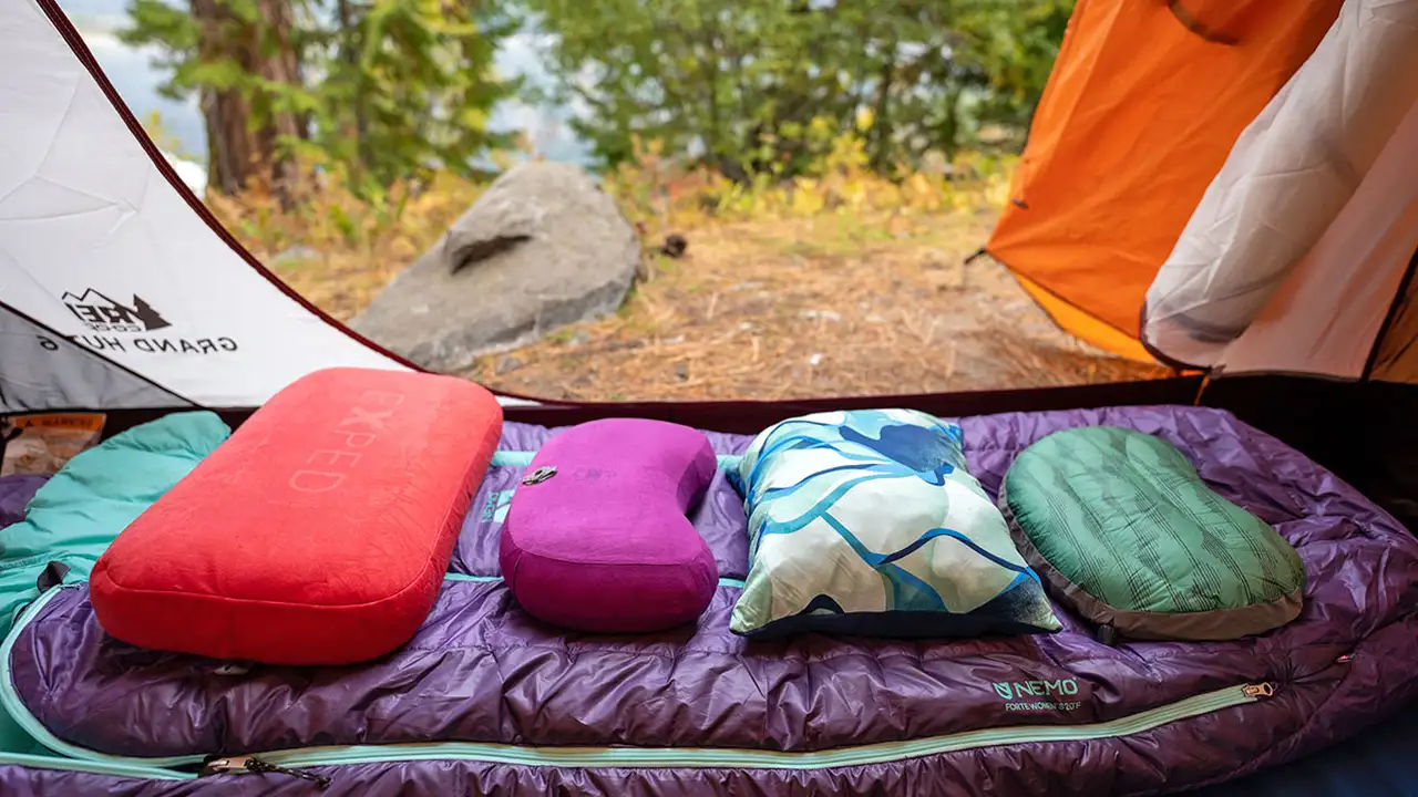 Two mint chocolate milkshakes with whipped cream and green sprinkles.