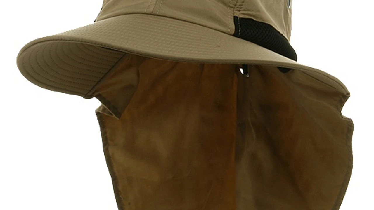 Close up on a plate of mashed potatoes, topped with baked pork chops with cream of mushroom soup, and a side of green beans.