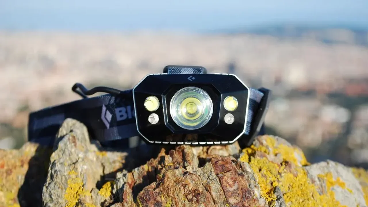 Close up on a plate of mashed potatoes, topped with baked pork chops with cream of mushroom soup, and a side of green beans.