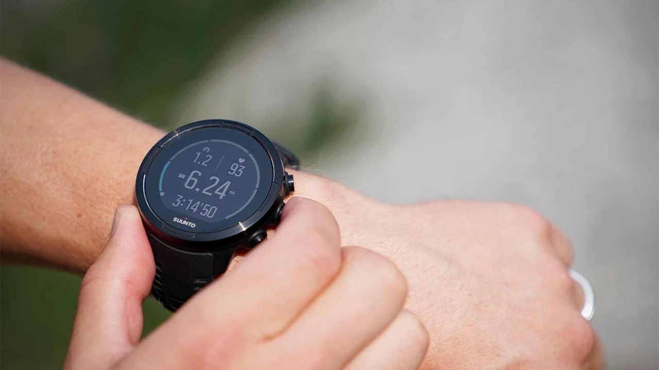 Close up on a plate of mashed potatoes, topped with baked pork chops with cream of mushroom soup, and a side of green beans.